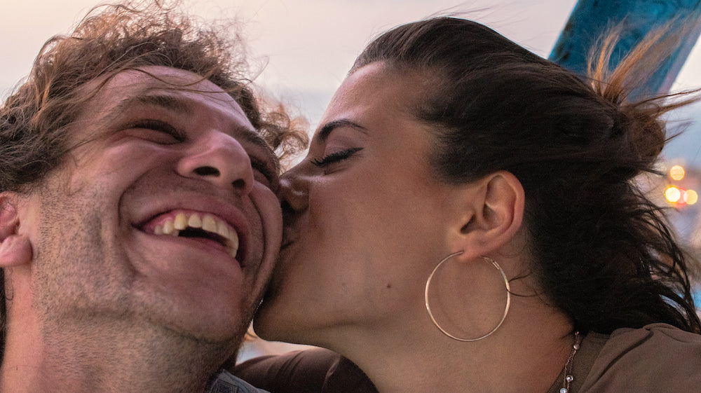 SolRX sunscreen protects lips with lip ice SPF 30. Lip care and lip baum for couple kissing