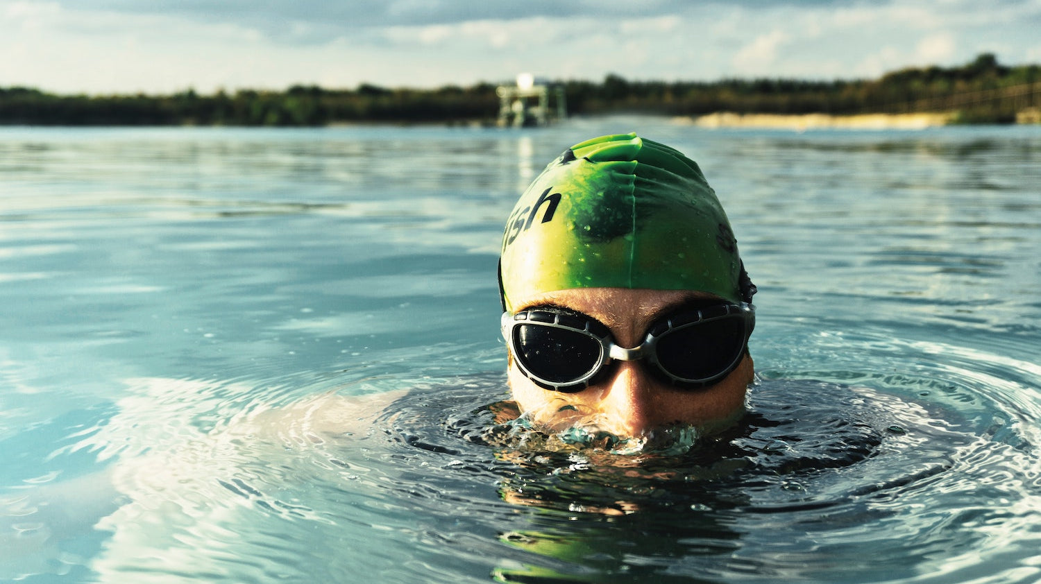 Swimmer wearing SolRX Waterblock water resistant sunscreen, independently tested through 8 hours of water exposure