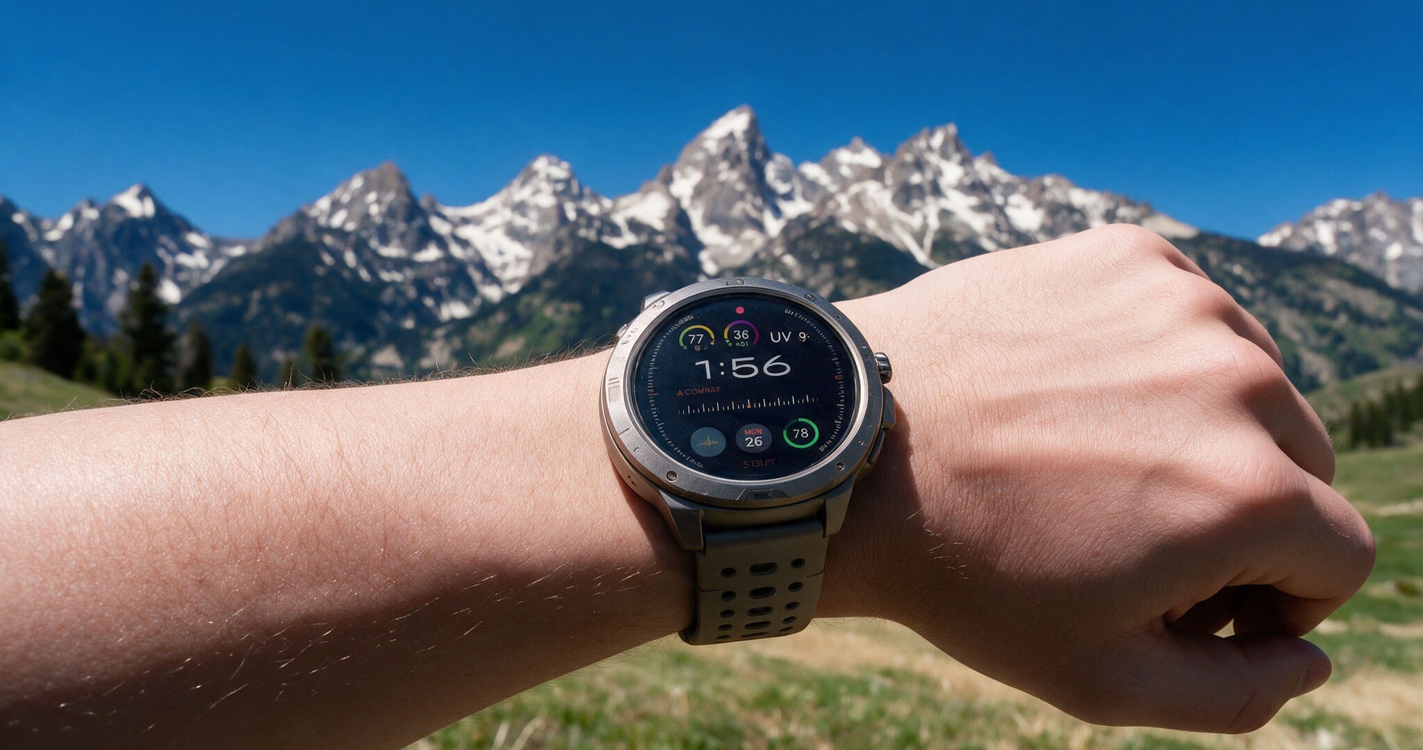 Smartwatch showing a UV Index of 9 against snow-capped Idaho mountains on a clear day