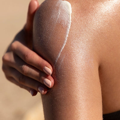 Applying SolRX body sunscreen reef-safe mineral SPF to skin sun protection